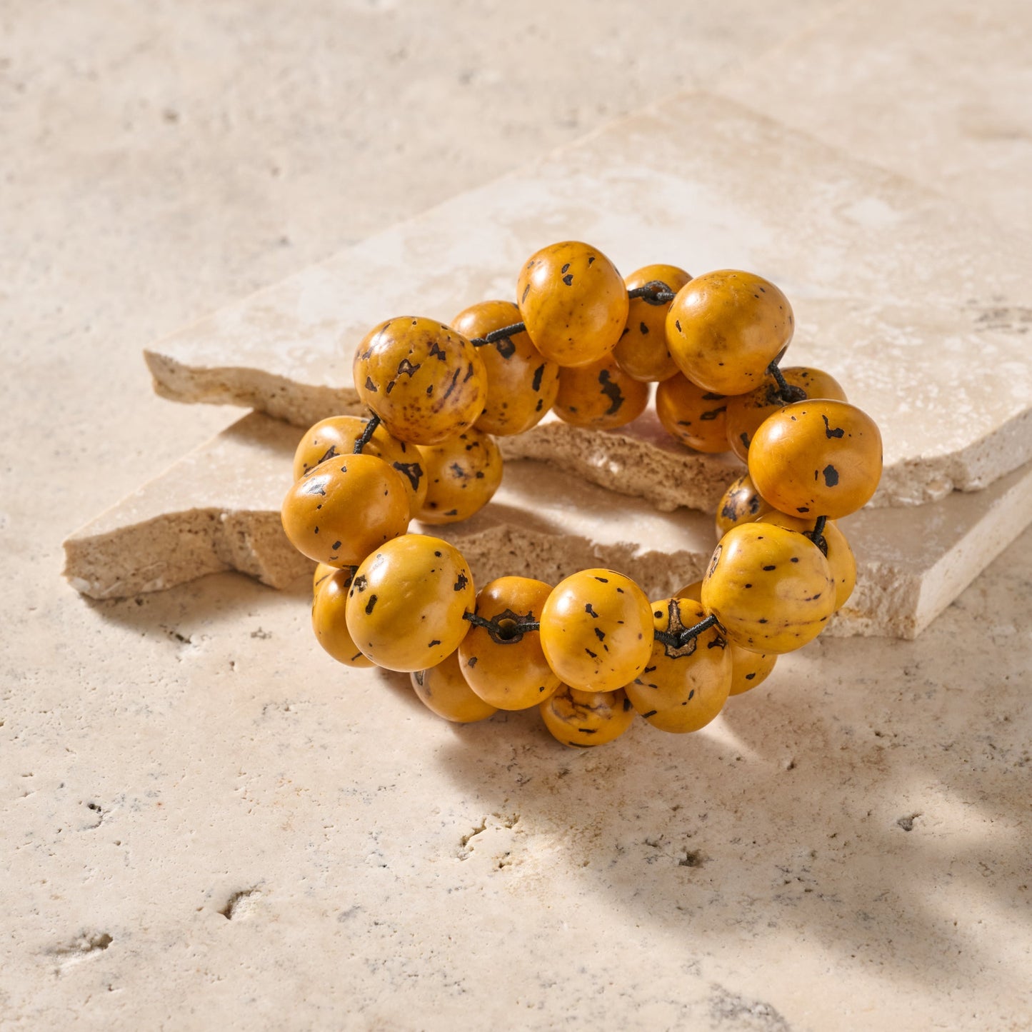Bracelet large round beads tagua adj yellow/black